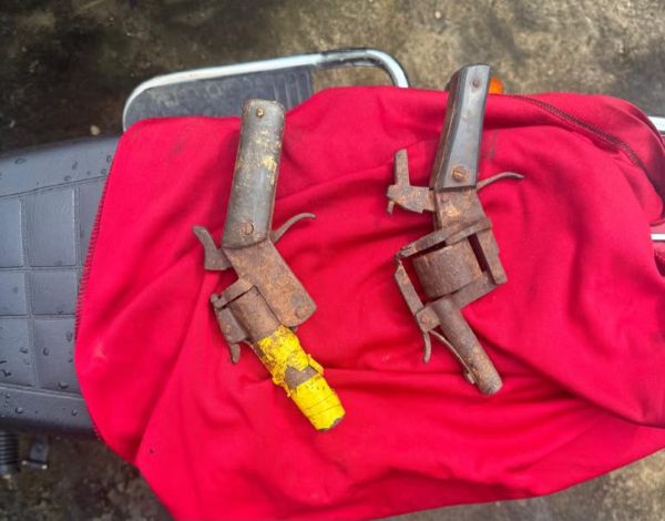 Police raid suspect’s home, recover two pistols